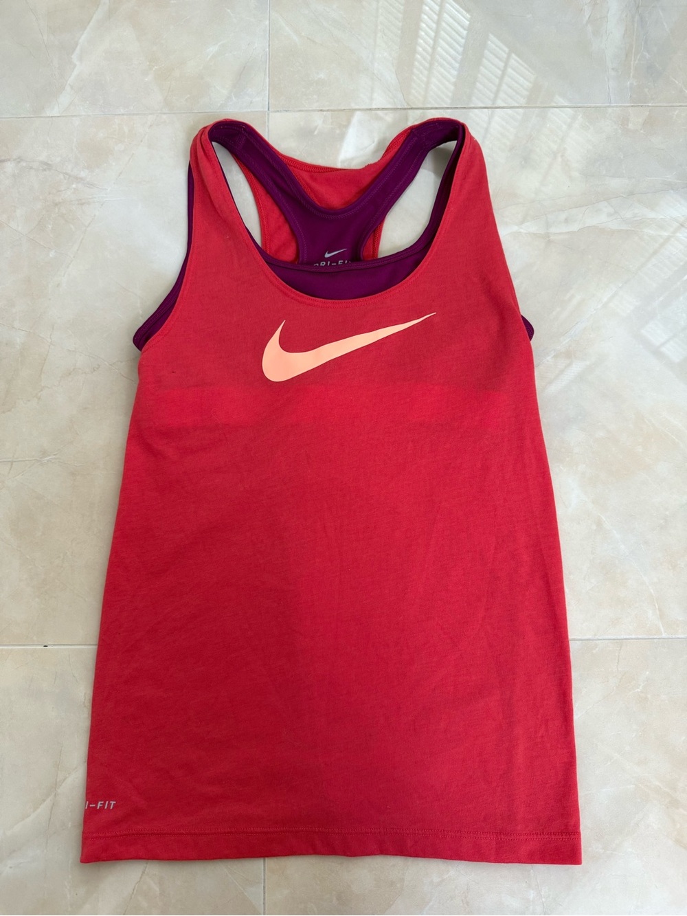 Nike Dri-FIT 2-in-1 racerback tank top with an orange Swoosh logo